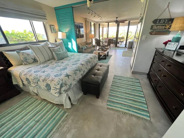 Bedroom opening straight through to the living area and patio in the ground-floor beachfront condo on St. Thomas