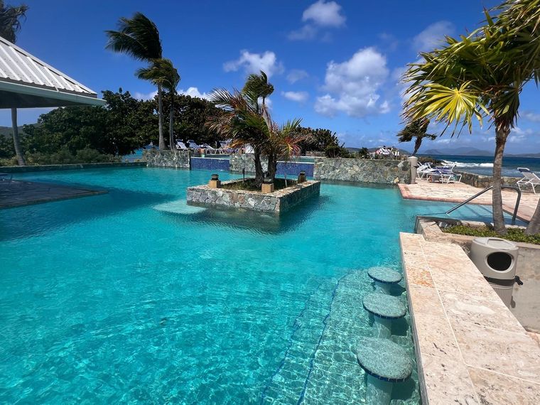 Multi-tier freshwater pool overlooking the Caribbean at this remote-work rental on St. Thomas with an ocean view