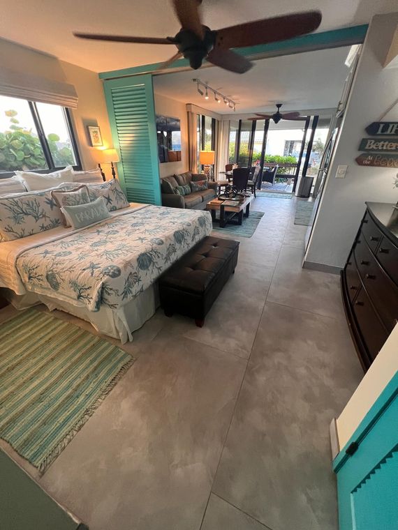 View from the bedroom through the living room to the ocean-facing glass doors of the St. Thomas condo on the beach